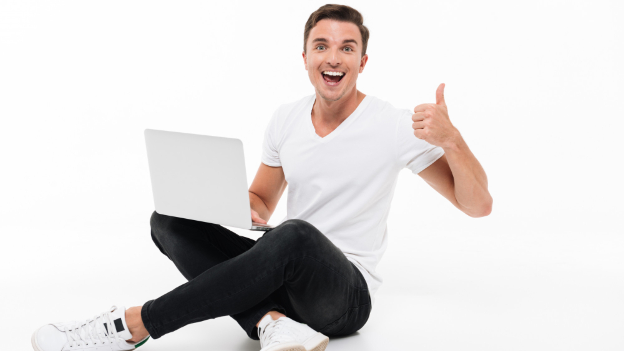 portrait-of-happy-excited-man-holding-laptop-computer
